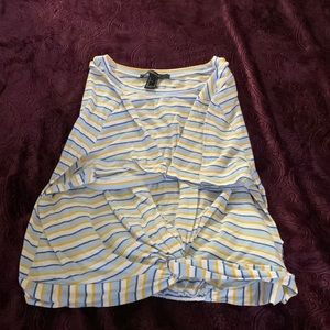 A yellow, white, and Blue crop top.